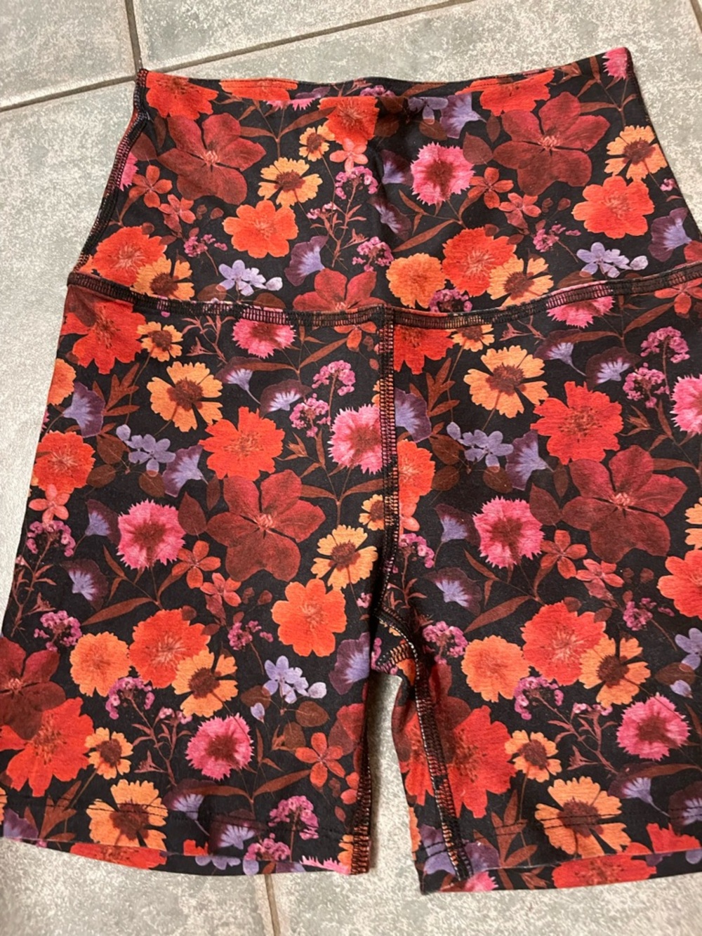 Beyond Yoga Black Floral High-Waist Bike Shorts with Red, Orange & Pink Flowers